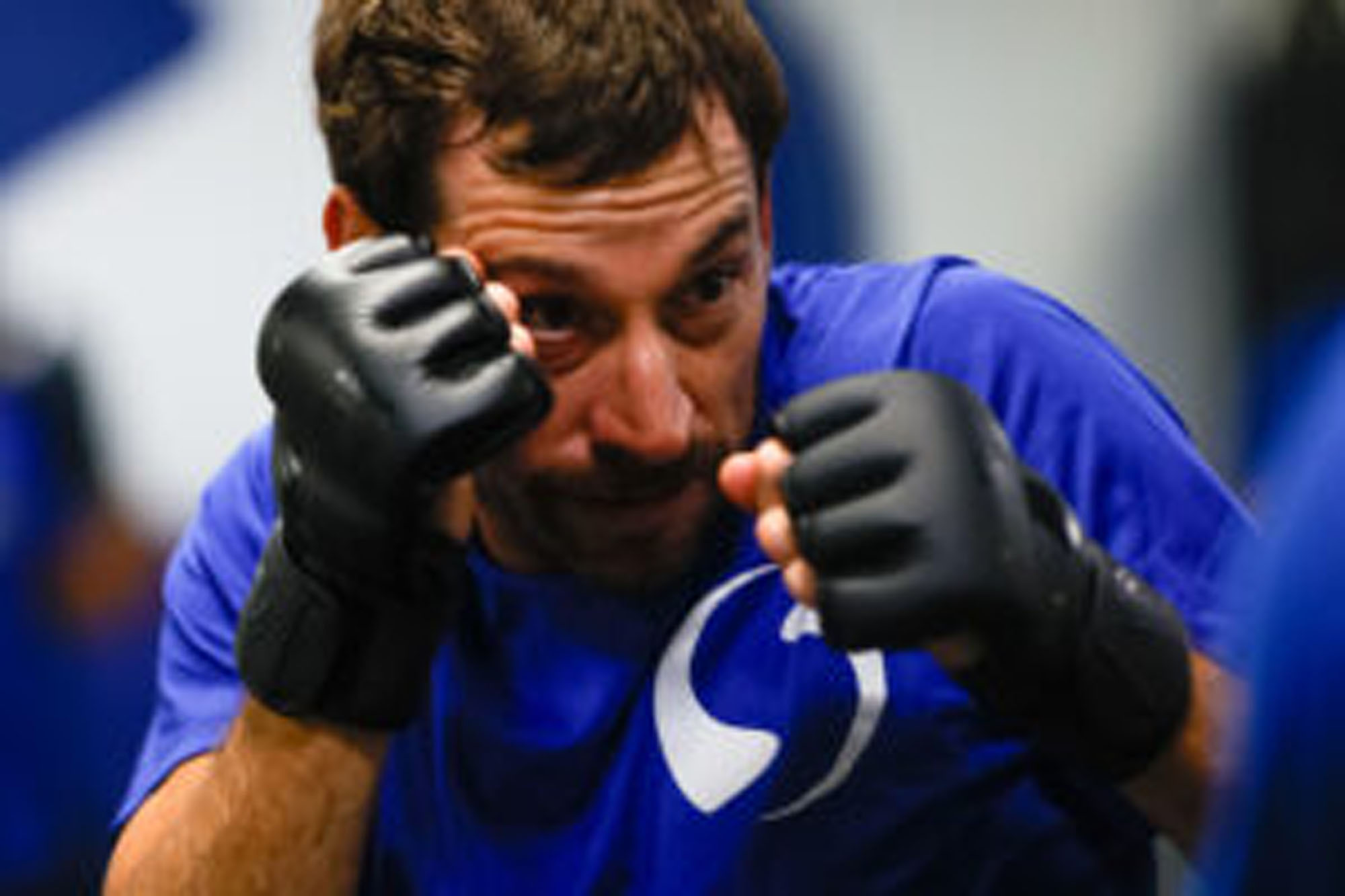 Man ready to fight with his hands up.