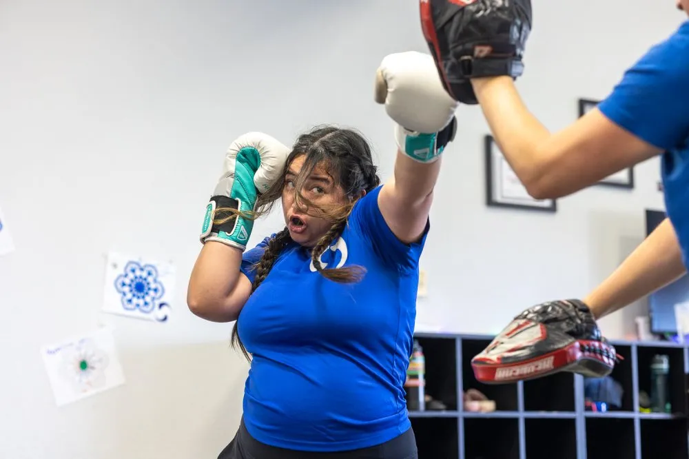 Woman practicing self defense techniques during martial arts training in Rancho Bernardo