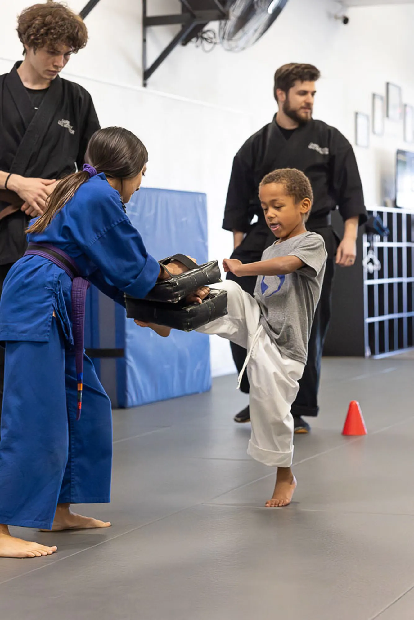 Young child learning kids martial arts skills and building confidence in San Diego