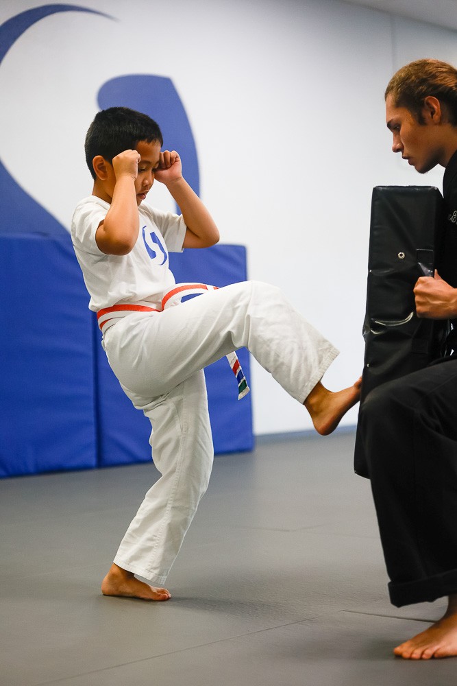 swiftkick student practicing kicking with instructor