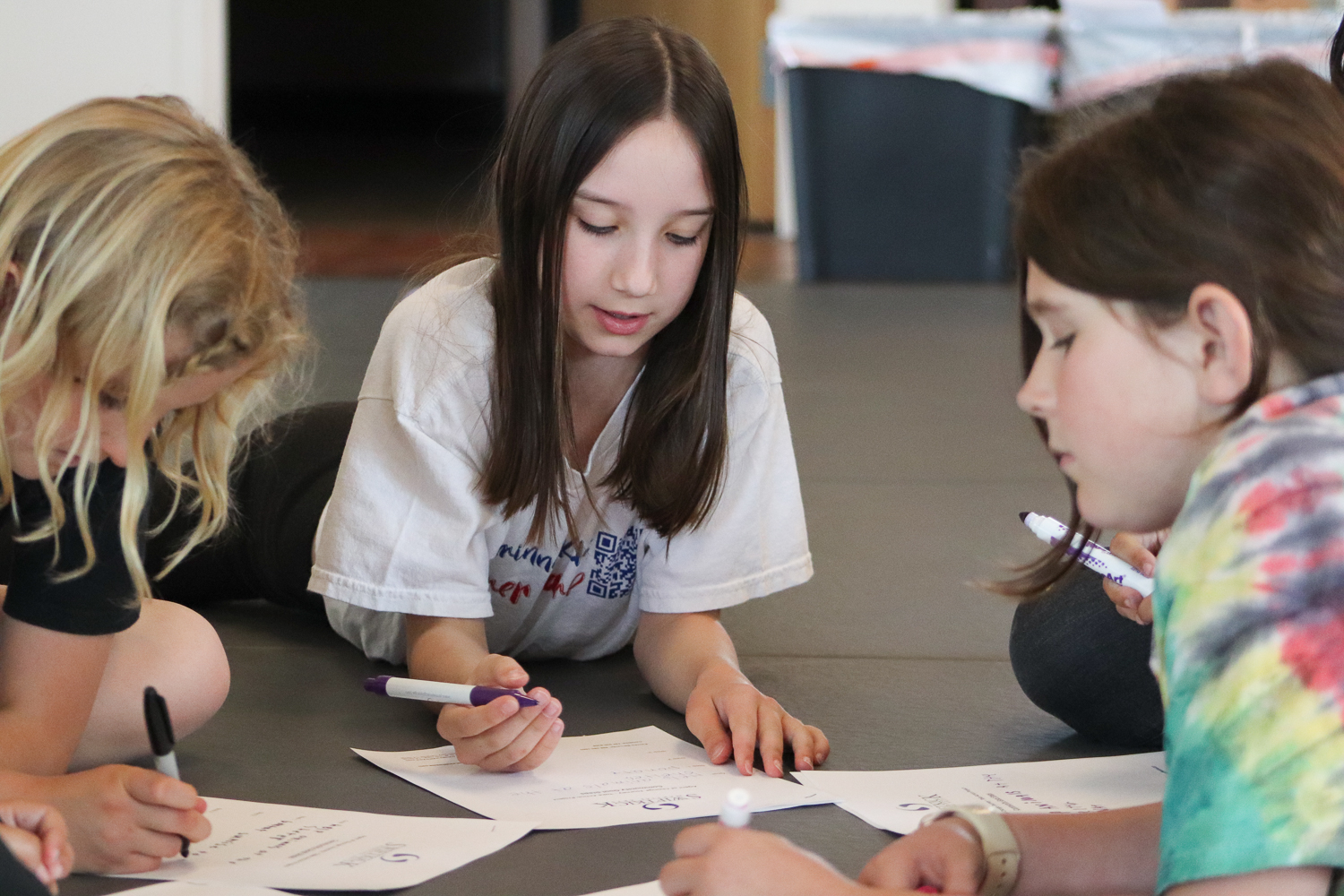 swiftkick-martial-arts-summer-camp-creative little girl and friends working on a creative project