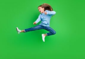 young girl kicking